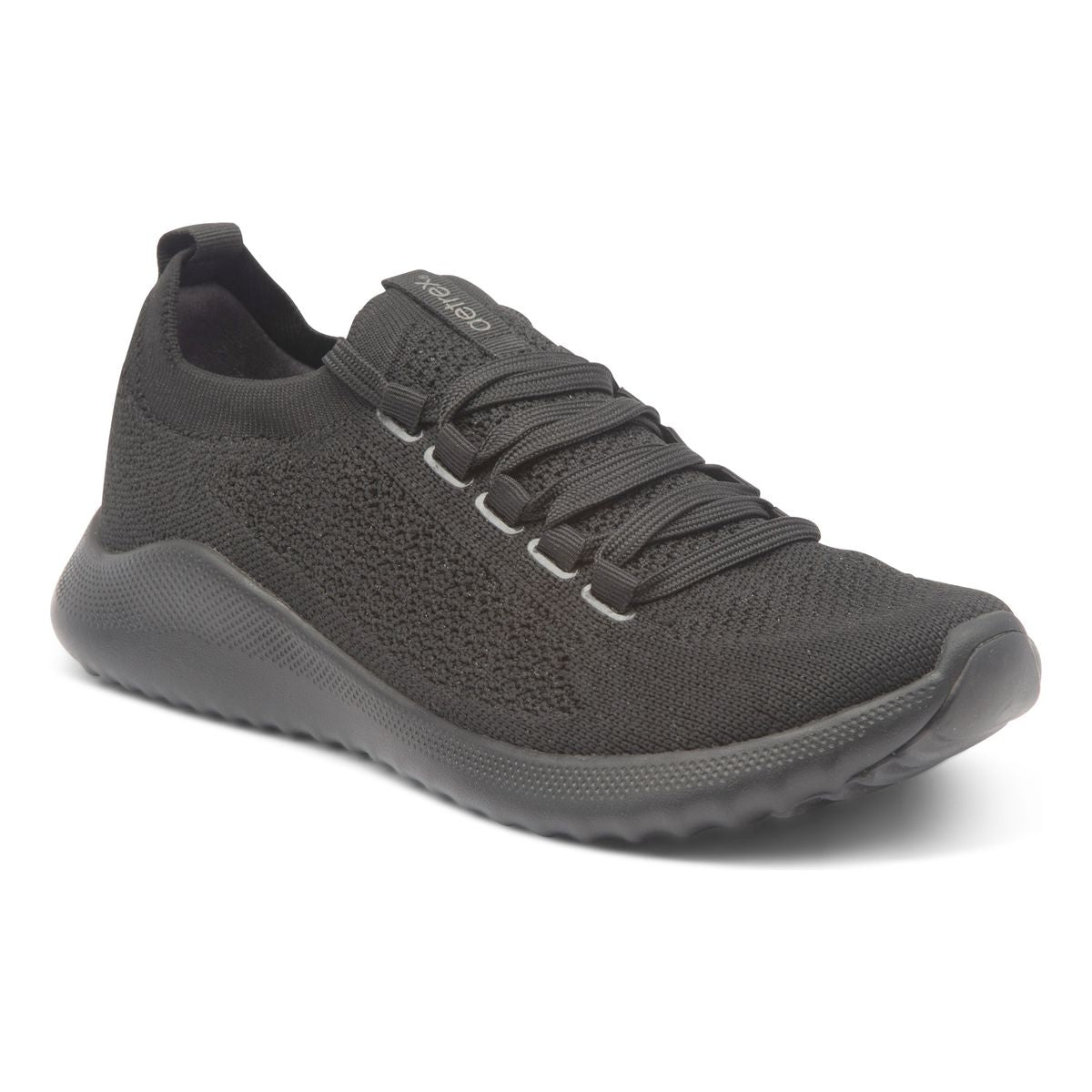 Carly Women's Arch Support Sneakers. A sleek black sneaker with laces, breathable mesh upper, padded heel, and low-profile .8-inch sole designed for support, comfort, and everyday wear.