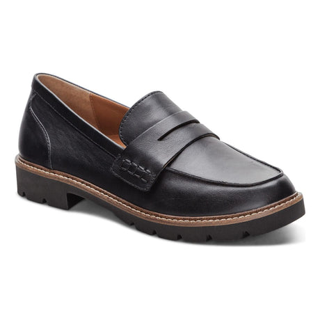 Black leather loafer with adjustable vamp strap, cushioned footbed, and low-profile outsole—designed for stylish support and all-day comfort.