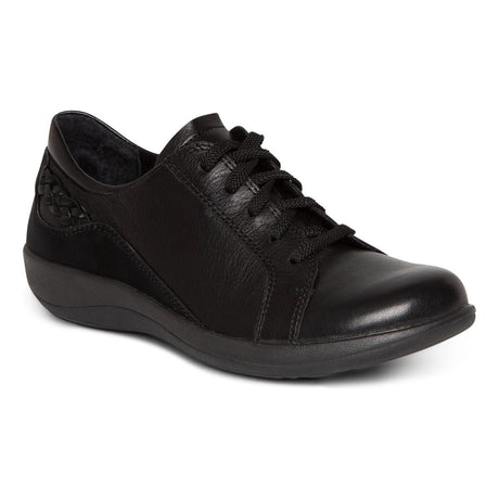 Black genuine leather Aetrex Dana lace-up shoe with clean design, sturdy rubber sole, adjustable laces, and subtle 1.3-inch heel, designed for orthotic comfort and foot support.