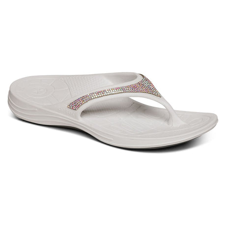 White Aetrex Fiji Sparkle sandal showing soft toe post, contoured arch support, and lightweight textured sole suitable for water use.