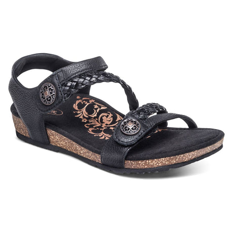 Black genuine leather sandal with two adjustable hook and loop straps, cushioned memory foam and cork footbed, padded collar, built-in arch support, and met bar pod for targeted foot pain relief.