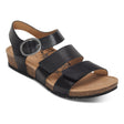 Black leather sandal with cutout detailing, two adjustable hook-and-loop straps, contoured memory foam footbed with arch support and metatarsal relief, and a low cork-rubber sole. Style #SC560W