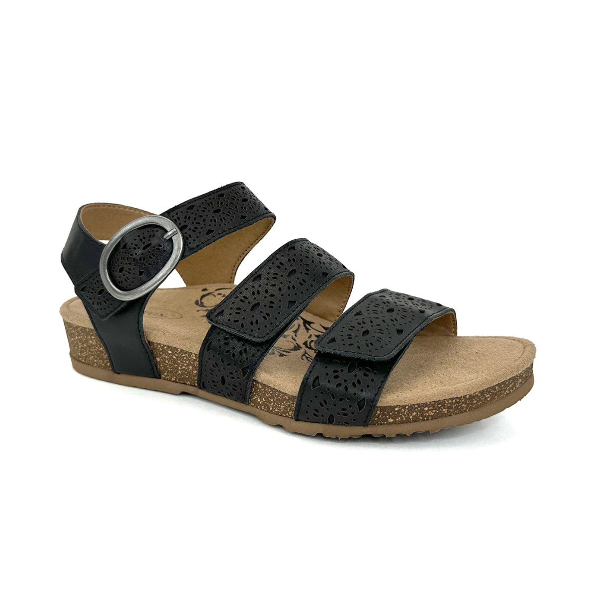 Black leather sandal with decorative cutouts, two adjustable hook-and-loop straps, contoured memory foam footbed with arch and forefoot support, and a low-profile cork-rubber outsole. Style #SC570