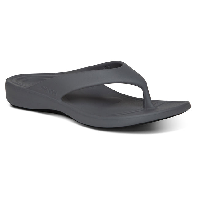 Grey EVA foam flip-flop with contoured heel, soft toe post, and textured footbed. Designed with built-in arch support and dual-density sole for shock-absorbing comfort and water-friendly wear. Style #L3100W