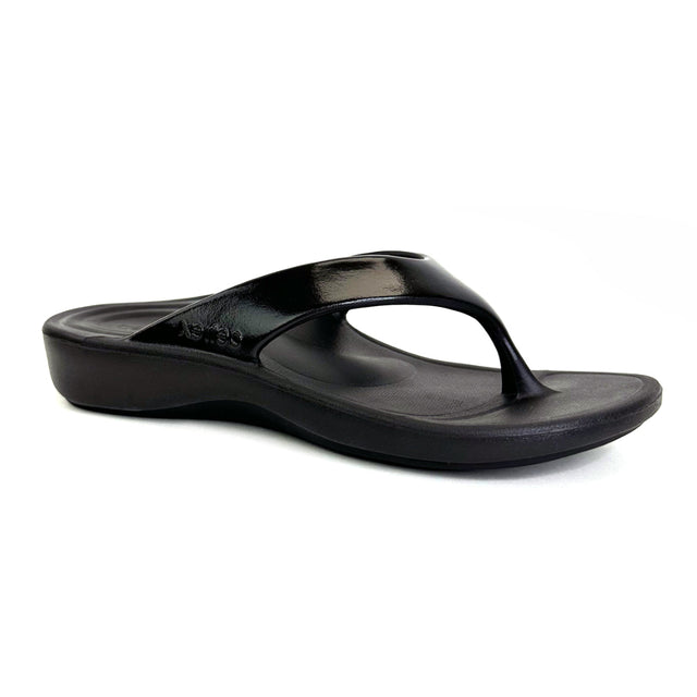Glossy black EVA thong sandal with contoured footbed, soft toe post, built-in arch support, and dual-density cushioning zones in the heel and forefoot. Lightweight, water-safe design for everyday wear. Style #L3030W
