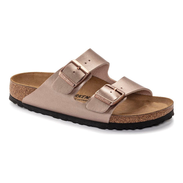 Women’s two‑strap sandal in metallic copper Birko‑Flor® with adjustable tonal buckles, contoured cork‑latex footbed lined in soft suede, and lightweight EVA sole for cushioned, supportive wear. Style #1023942