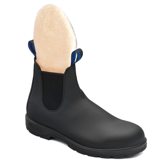Blundstone 566 Winter Waterproof Unisex Boot in black leather with elastic panels, removable sheepskin footbed, Thinsulate insulation, XRD™ heel pad, and polyurethane midsole for warm, dry, and comfortable winter wear. Style #566