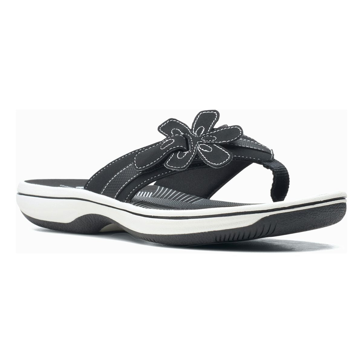 Clarks Brinkley Flora women’s thong sandal in black with floral strap detail with white cushioned soles. Style #26159867