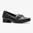 Clarks black slip-on loafer with a low block heel and silver metal bit hardware on the vamp. 26184381