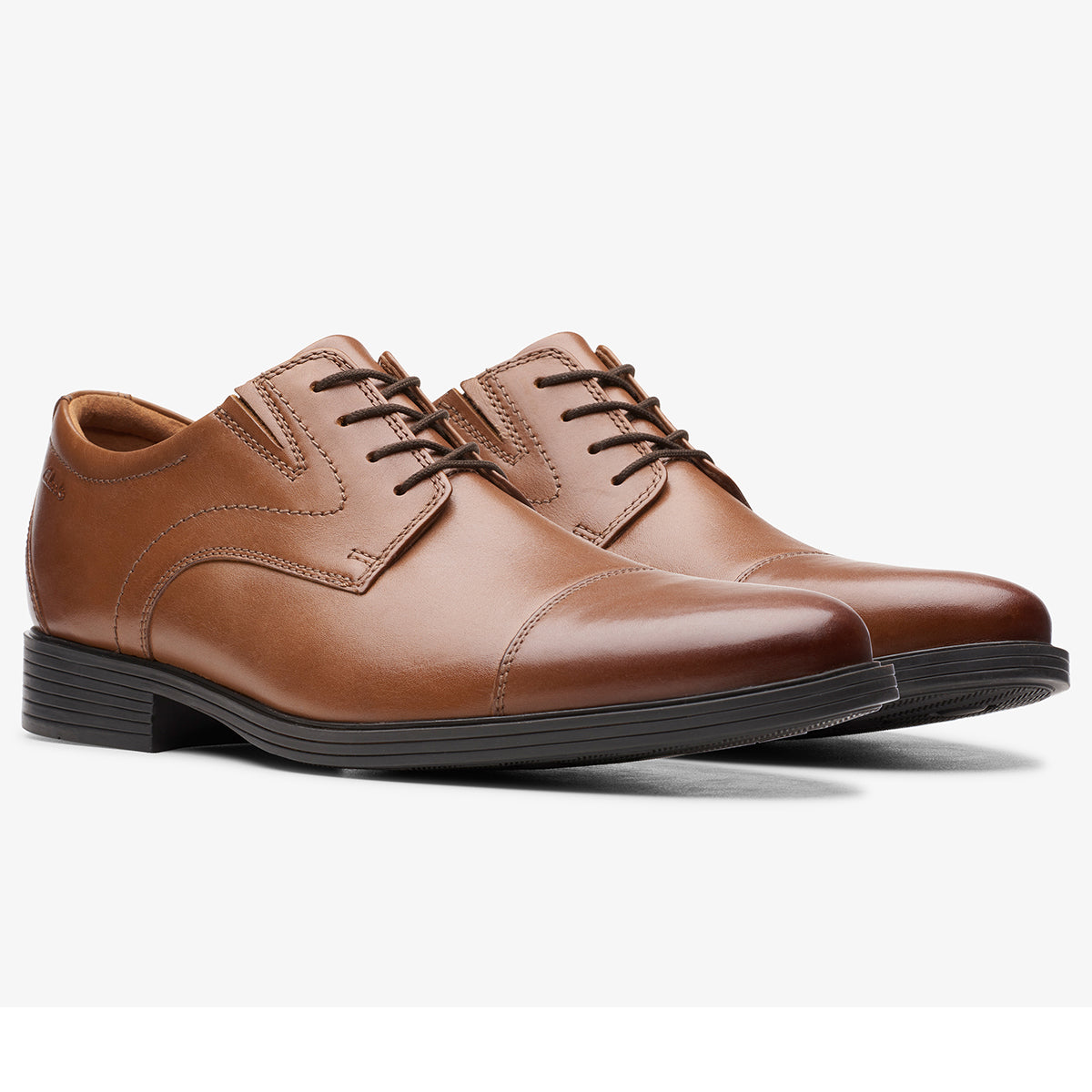 Clarks Whiddon Cap Leather Oxford Shoes in dark tan leather with cap-toe design, lace-up closure, and cushioned insole – available at Walking on a Cloud Canada.