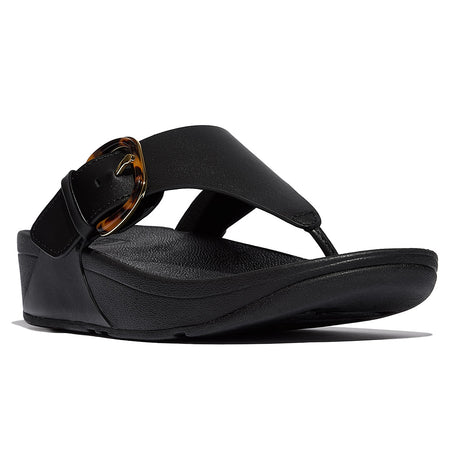 Black FitFlop Lulu Buckle flip-flop (JE9-090) with a tortoiseshell buckle, showcasing the sandal's design.