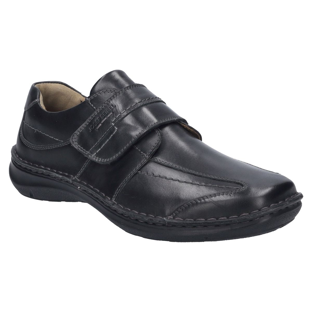 Men’s black leather slip-on shoe with wide fit, contrast stitching, elastic side panels, and removable insole. Built for comfort, support, and easy wear. Style #43360_370