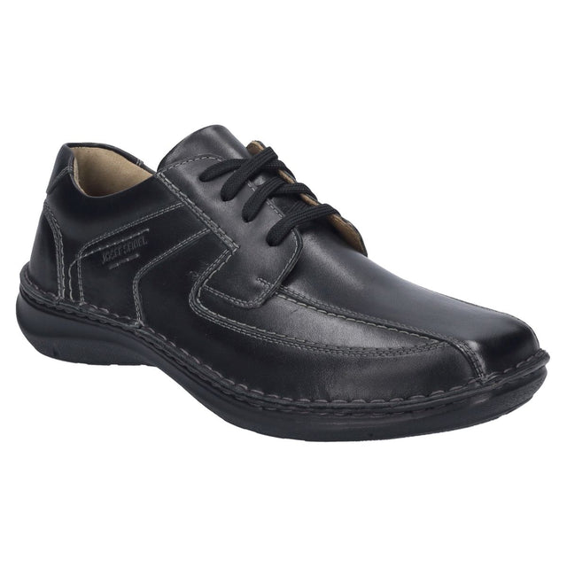 Men’s black leather slip-on shoe with wide fit, elastic side gores, contrast stitching, and removable cushioned footbed. Built for daily comfort and orthopedic support. Style #44908-100