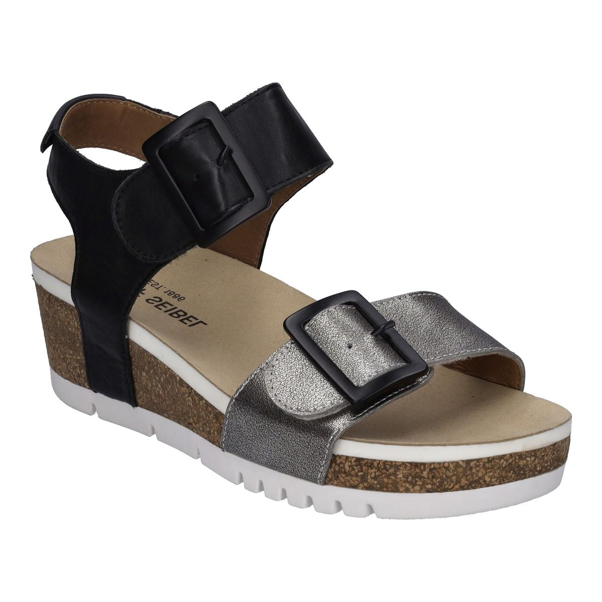 Black and silver sandal with cork wedge sole on a white background. 83502-771.