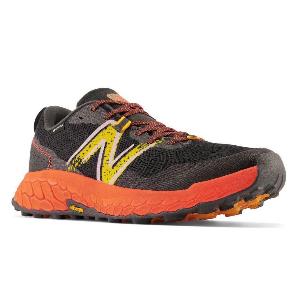 New Balance Men's Fresh Foam Hierro v7 GORE-TEX trail shoe in black, orange, and yellow. MTHIERX7