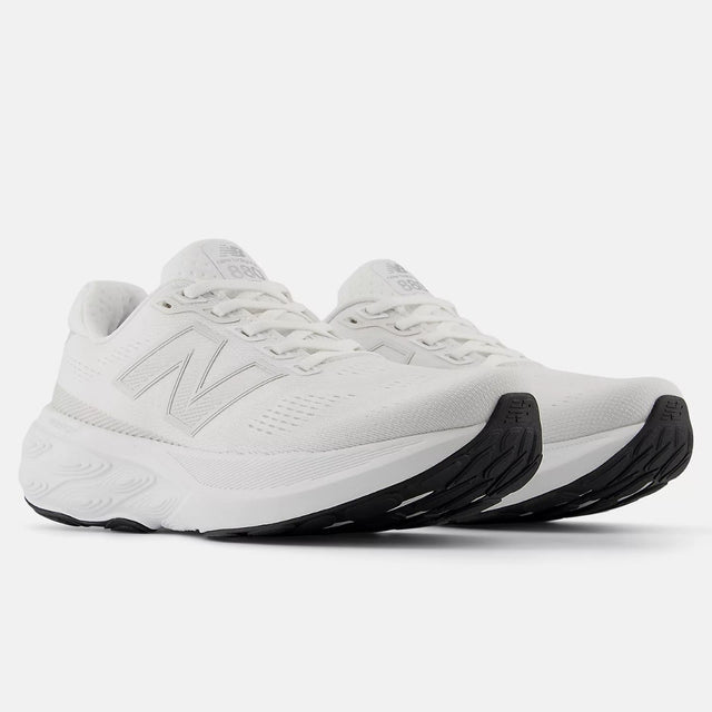 White New Balance Women's Fresh Foam X 880v15 running shoe with breathable engineered mesh upper and black rubber outsole. Style #W880W15.