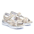 Rieker women's sandal in multicolour pebble pattern with Velcro strap, cushioned Antistress footbed, and flexible low heel rubber sole. Style #66979-90