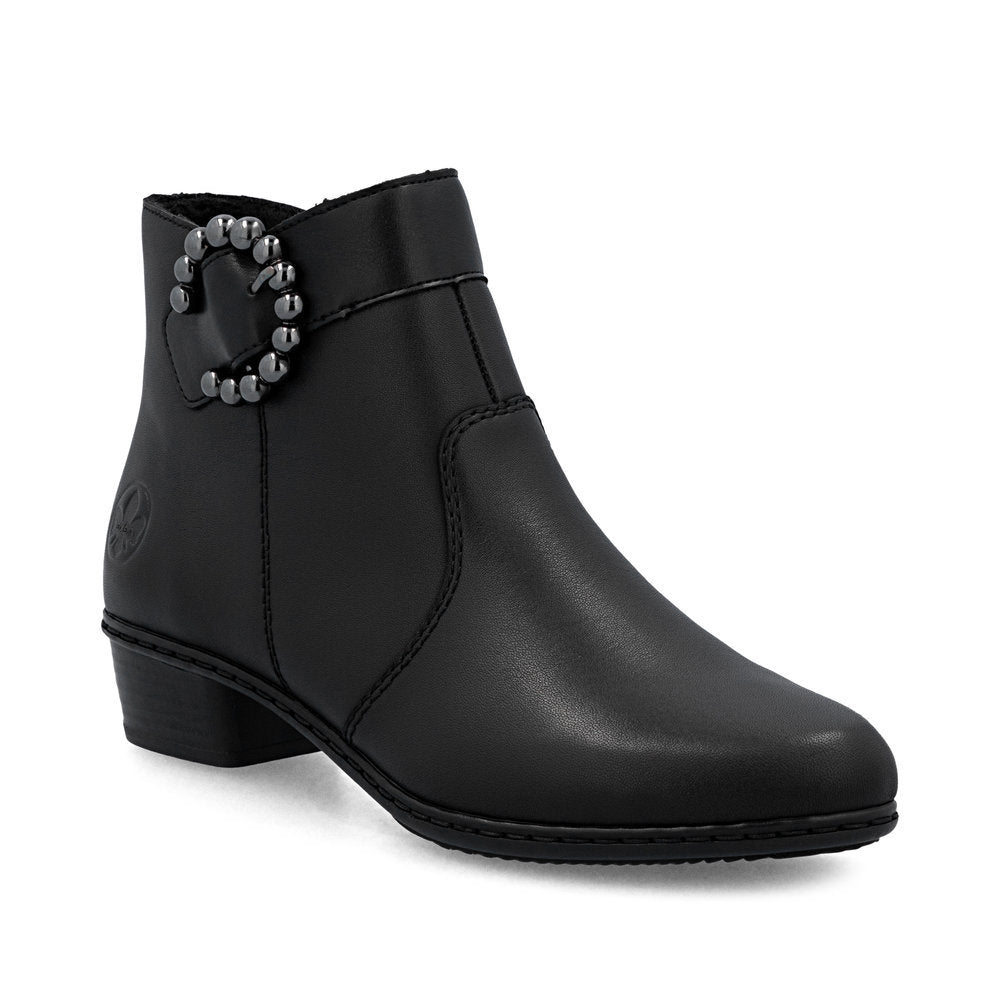 Rieker Y0797-00 women's black ankle boot with a decorative buckle, low block heel, and cozy lining.