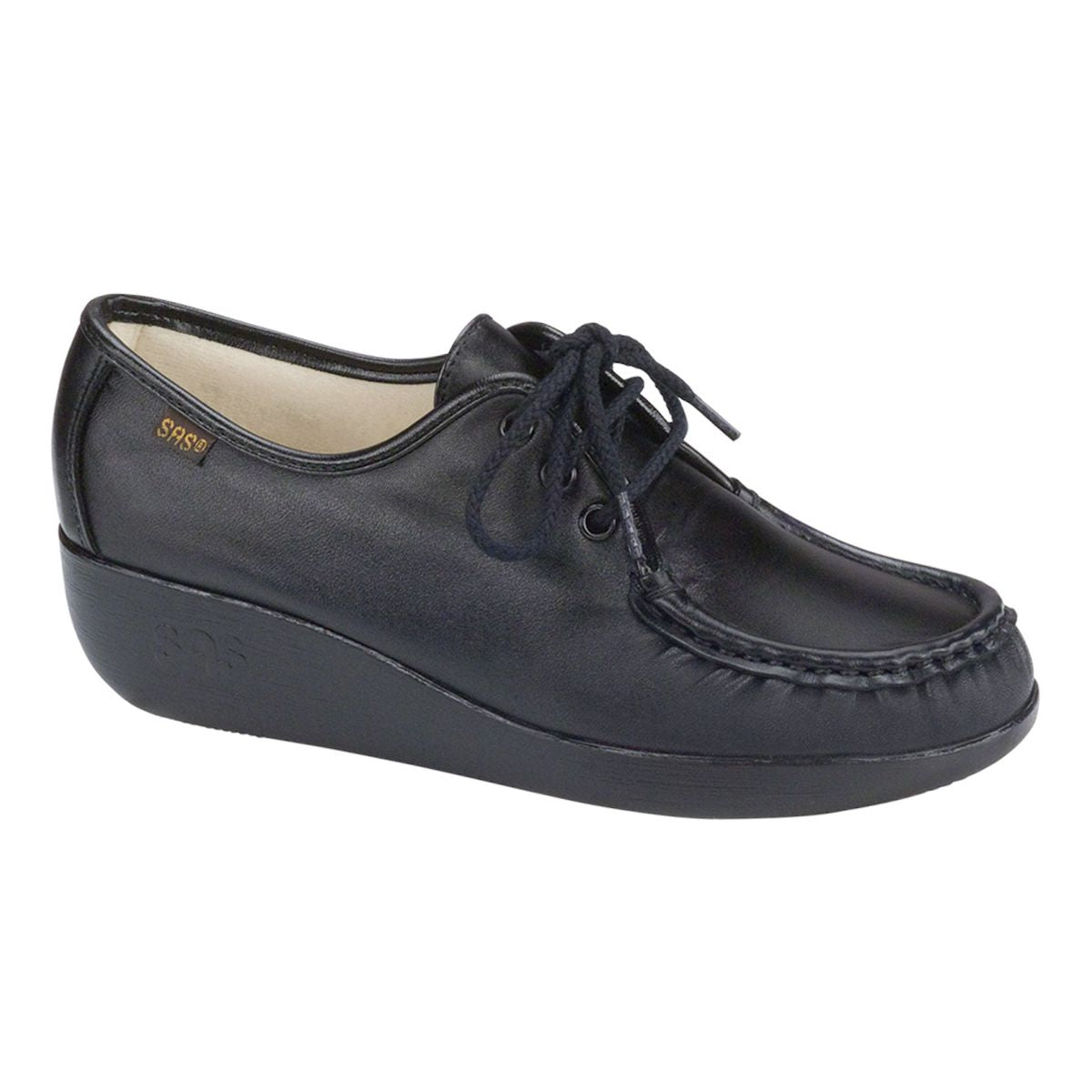Black moccasin-style shoe with soft lining, padded heel and arch, and a stable polyurethane wedge sole for comfort and support. Style #0001-020