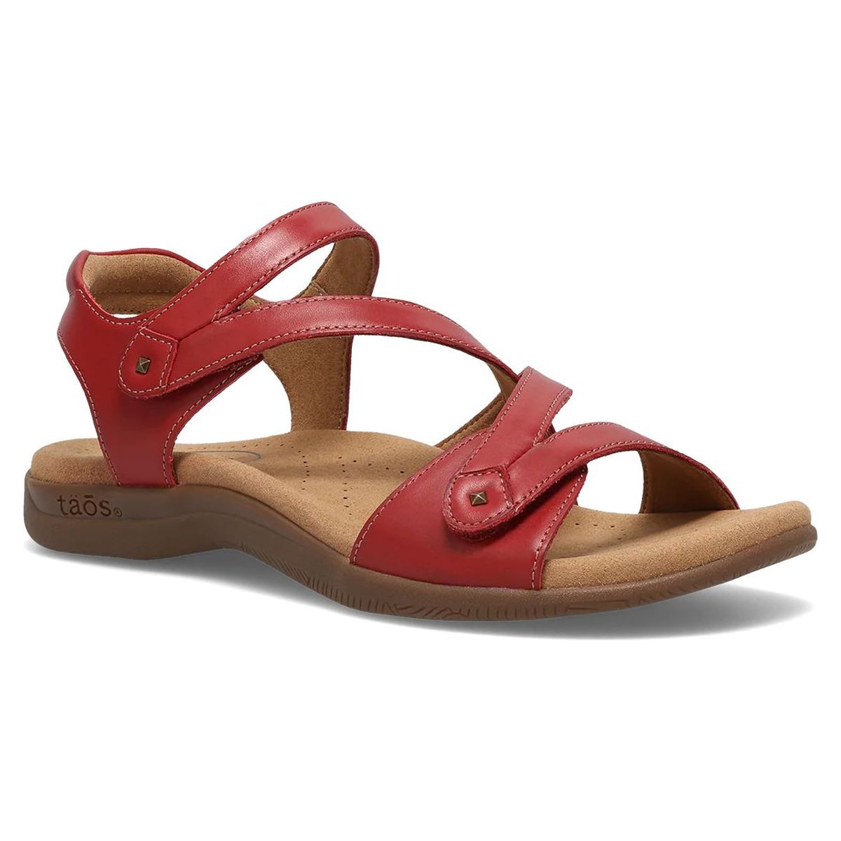 A red leather strappy sandal with adjustable hook-and-loop straps and a contoured cork footbed.