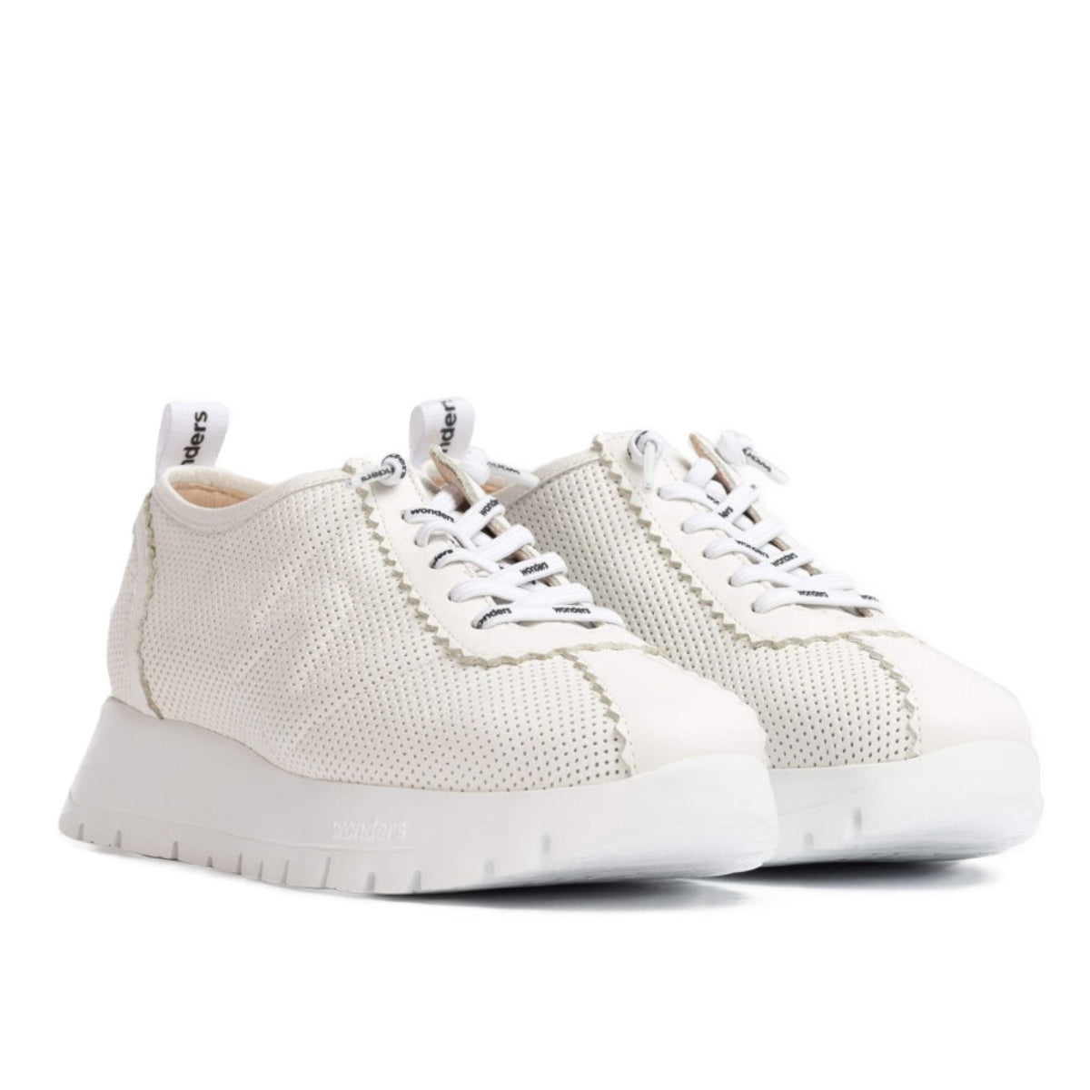 Off-white leather low-top sneaker with a flared wedge sole and lace-up front, blending sporty comfort with minimalist European design. Style #A2424-0350