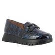 Sleek black leather platform loafer with a chunky sole, polished finish, and elastic side inserts for a secure fit and contemporary flair. Style #A2430-0070