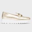 Metallic gold leather loafer with a thick flared platform sole, rounded toe, and elastic side panels for easy slip-on wear and bold modern style. Style #A2462-2235
