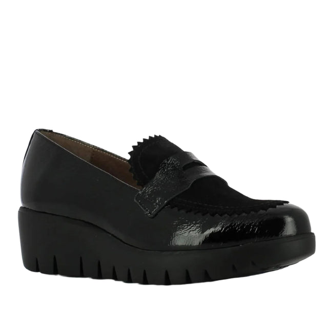 Glossy black patent leather loafer with a modern slip-on design, cushioned insole, and low wedge sole for stylish everyday comfort and European craftsmanship. Style #33223