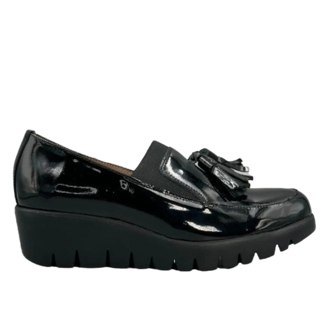 Shiny black patent leather loafer with a sleek slip-on profile, cushioned removable insole, and a lightweight WondersFly™ sole for all-day stylish comfort. Style #3342