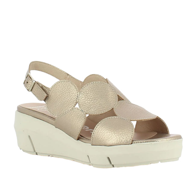 Gold-toned metallic leather wedge sandal with a modern slingback strap, cushioned footbed, and flexible sole designed for stylish day-to-night wear and comfort. Style #D8210-0067