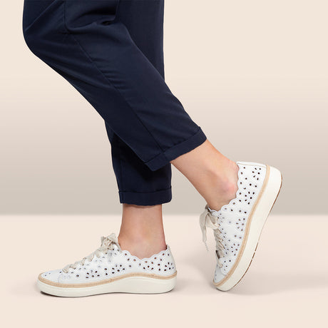 Professional shoe fitting — measuring foot size for properly fitted comfort shoes