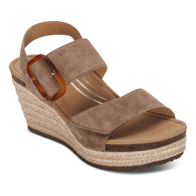 Aetrex Ashley Women's Arch Support Wedge in Taupe. Aetrex Ashley Taupe wedge sandal features a 3” heel, arch support, and memory foam cushioning for stylish, all-day comfort.