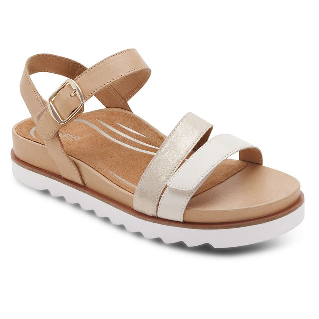 Women's champagne leather sandal with adjustable straps, gold buckle, and a white serrated platform sole. Style #SF171