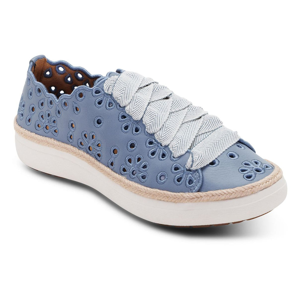 Women's hazy blue leather sneaker with floral laser-cut details, thick woven laces, and a white platform sole. Style #CA718
