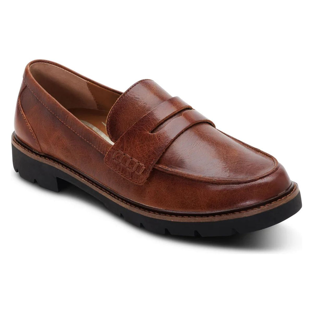Aetrex cognac brown leather penny loafer with apron toe stitching, supportive footbed, and black lug sole. Style #LL104