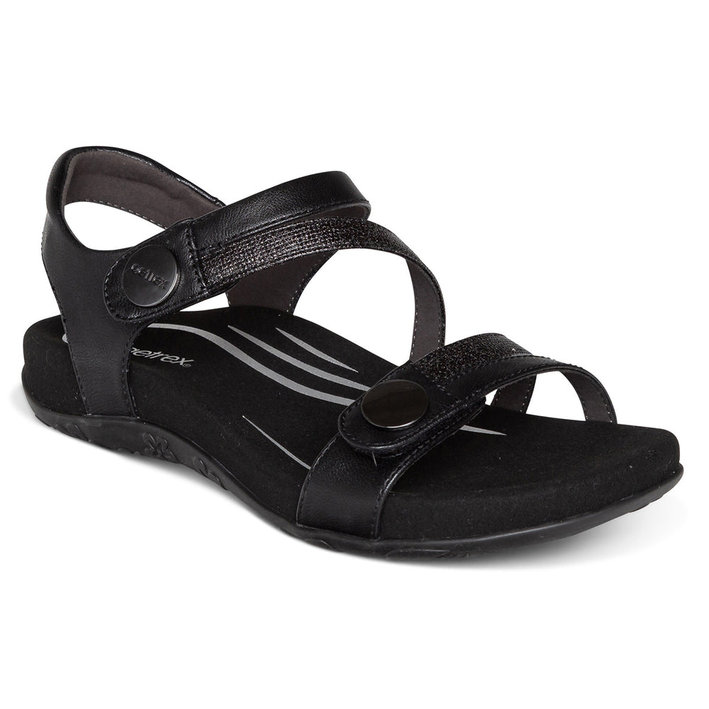 Black sandal with two fully adjustable hook and loop straps, contoured cushioned footbed, built-in arch support, and a lightweight rubber outsole for everyday comfort and pain relief.