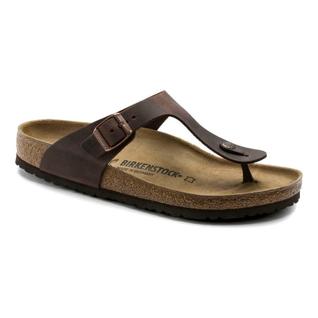 Women’s dark brown thong-style sandal with an adjustable buckle strap and a contoured cork footbed. Style #743831