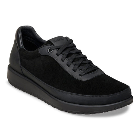 Women’s black lace-up sneaker with mixed matte leather and plush suede panels on a thick black rubber sole. Style #1031526