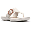 Off-white thong sandal with hexagonal buckle detail and contoured comfort sole. Style # 26186794
