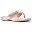 Dusty rose metallic women's thong sandal with an adjustable velcro strap and a cushioned white sole. Style #26186811