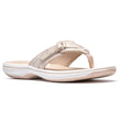 Clarks Breeze Sea gold women's thong sandal with adjustable strap, cushioned white sole, and metallic finish. Style #26186813