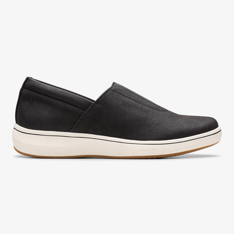 Clarks BreezeSky Ria black slip-on sneaker with a subtle textured upper and a thick white sole. Style: 26184296