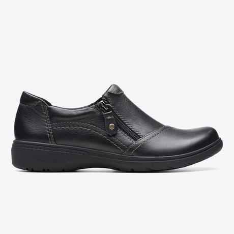 Clarks Carleigh Ray black leather slip-on shoe with side zipper, contrast stitching, and low wedge sole. 26175051