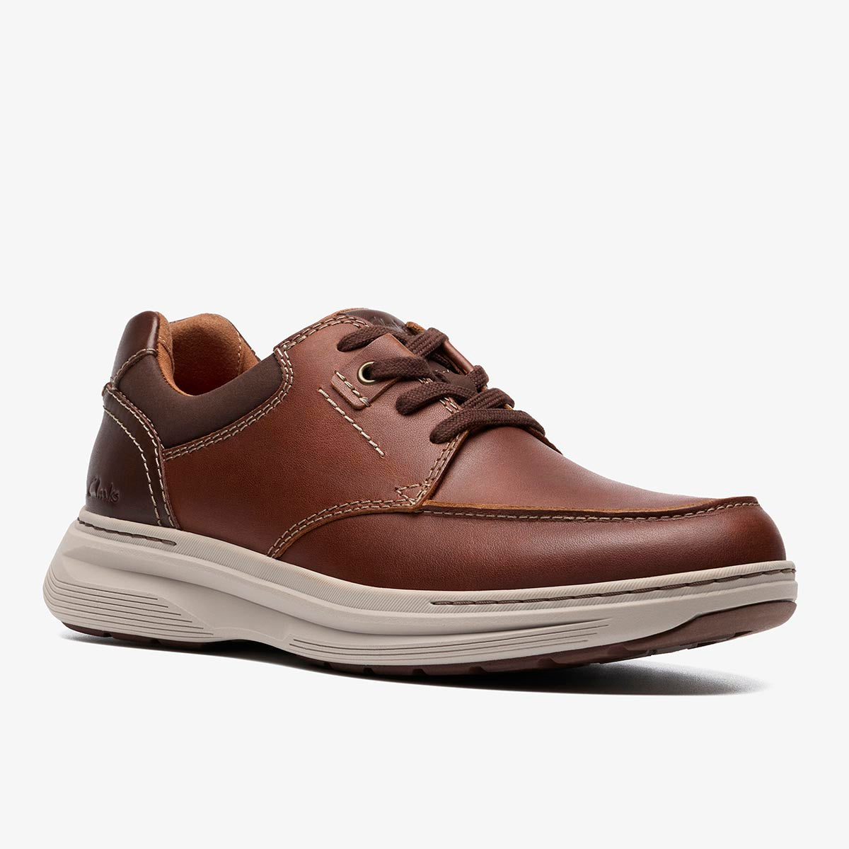 Clarks Craftwell Lace tan leather shoe with contrast stitching, elastic laces, and a thick, light-colored EVA sole. Style: 26184710
