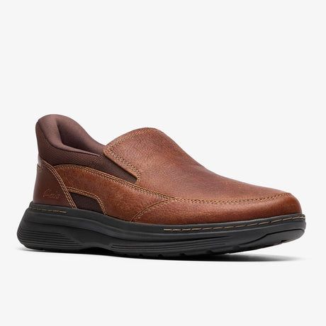 Clarks Craftwell Step brown tumbled leather slip-on shoe with a padded collar, twin stretch panels, and a thick black sole. Style: 26184712
