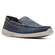 Blue slip-on shoe with white sole on a white background. Clarks Gorwin Step in Navy Nubuck. 