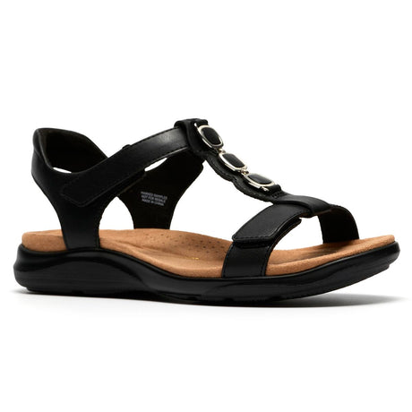 Women's black leather T-strap sandal with decorative gemstones, adjustable straps, and tan footbed. Style #26185964