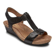 Black leather Cobb Hill T-strap sandal with floral cutouts and wedge heel. CI0192.