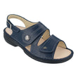 Women’s navy blue leather sandal with two adjustable straps, silver decorative button, and a black sole. Style #2560604041