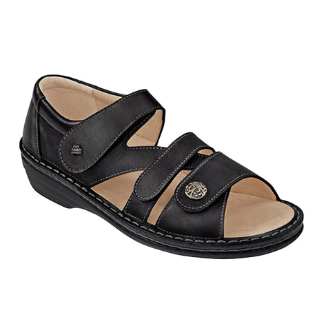 Black leather sandal with three adjustable Velcro straps, one featuring a decorative button, suede-lined soft footbed, and low-profile sole for cushioned orthopedic support. Style #8258514099